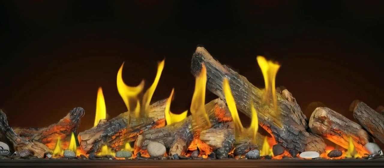 Oak log set burning in a linear gas fireplace, close-up