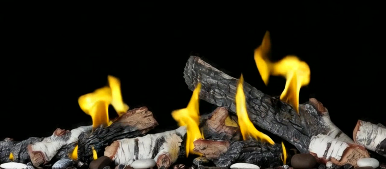 Birch log set burning in a linear gas fireplace, close-up